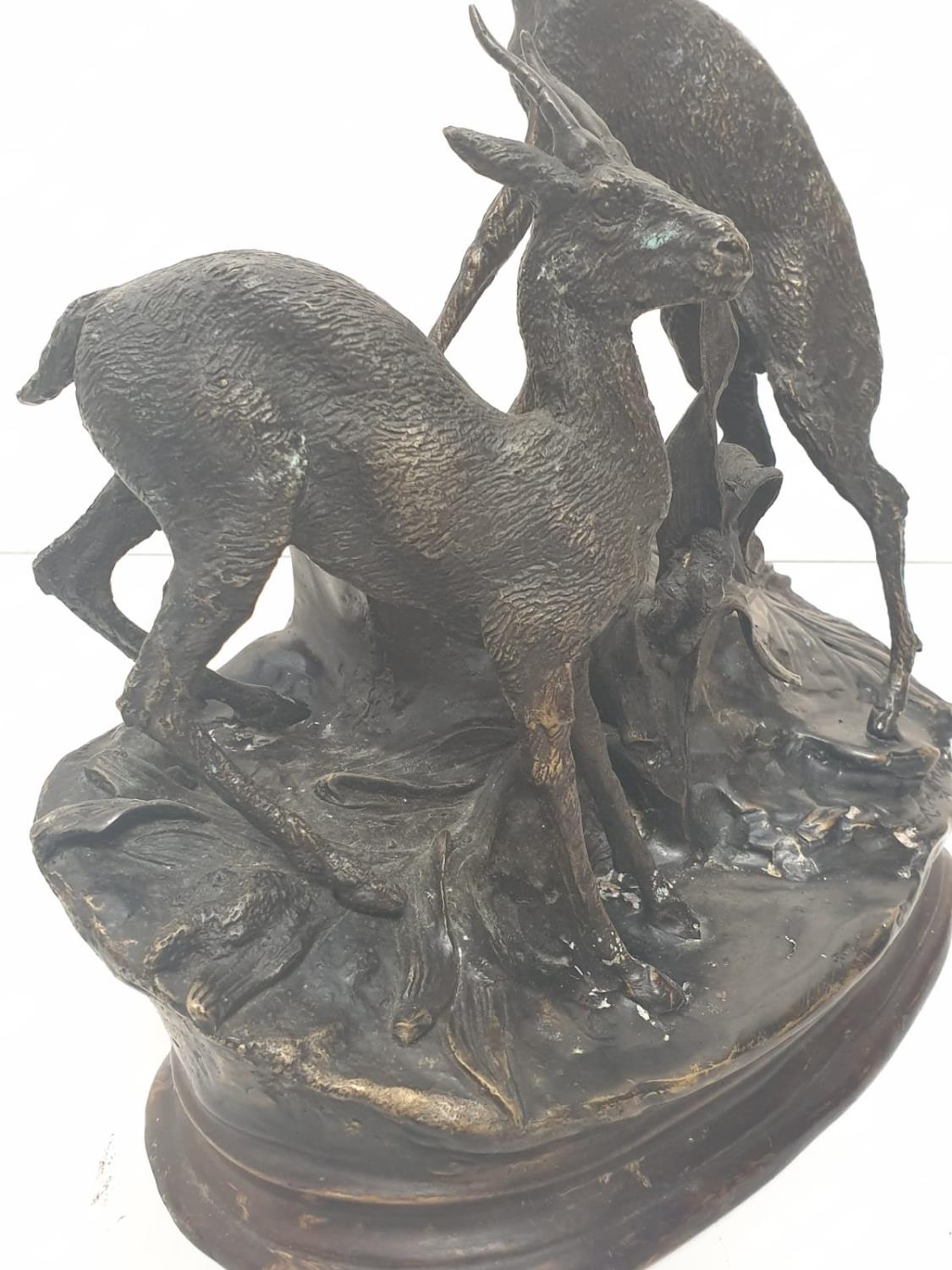 A vintage bronze sculpture of two deer, alert to the danger around them. 25 x 30 cm. - Image 2 of 7