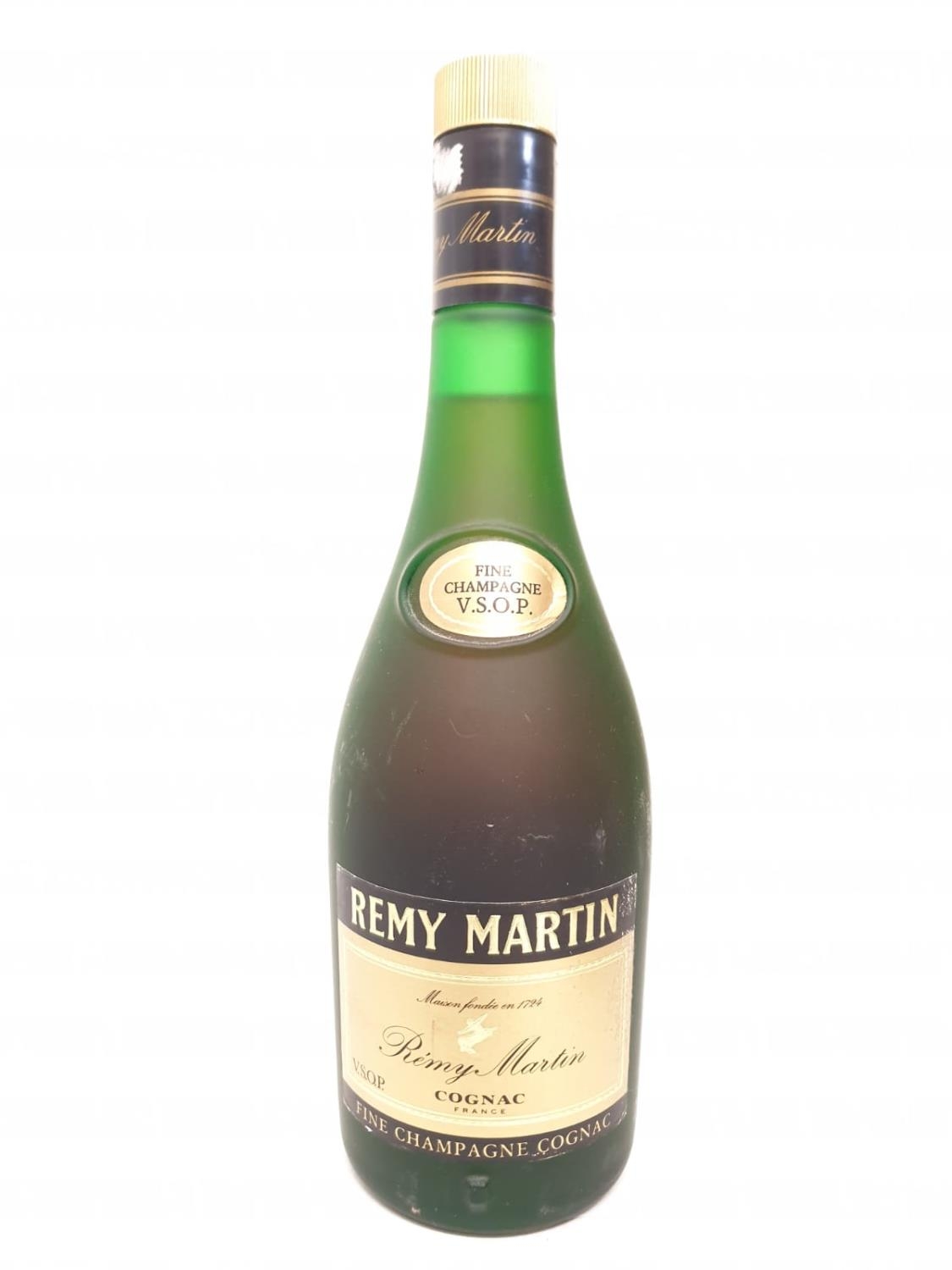 A bottle of vintage V.S.O.P Remy Martin cognac.