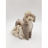 A Lladro porcelain figurine - mother poodle with pups. 14cm high. Good condition.