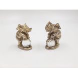 A miniature pair of pewter elephants balancing on a crystal ball. Comes in presentation box. 4cm