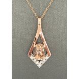 Pendant in 10K rose gold with CZ and morganite with chain in rose gold. Aprox 18" and weighs 1.9g.