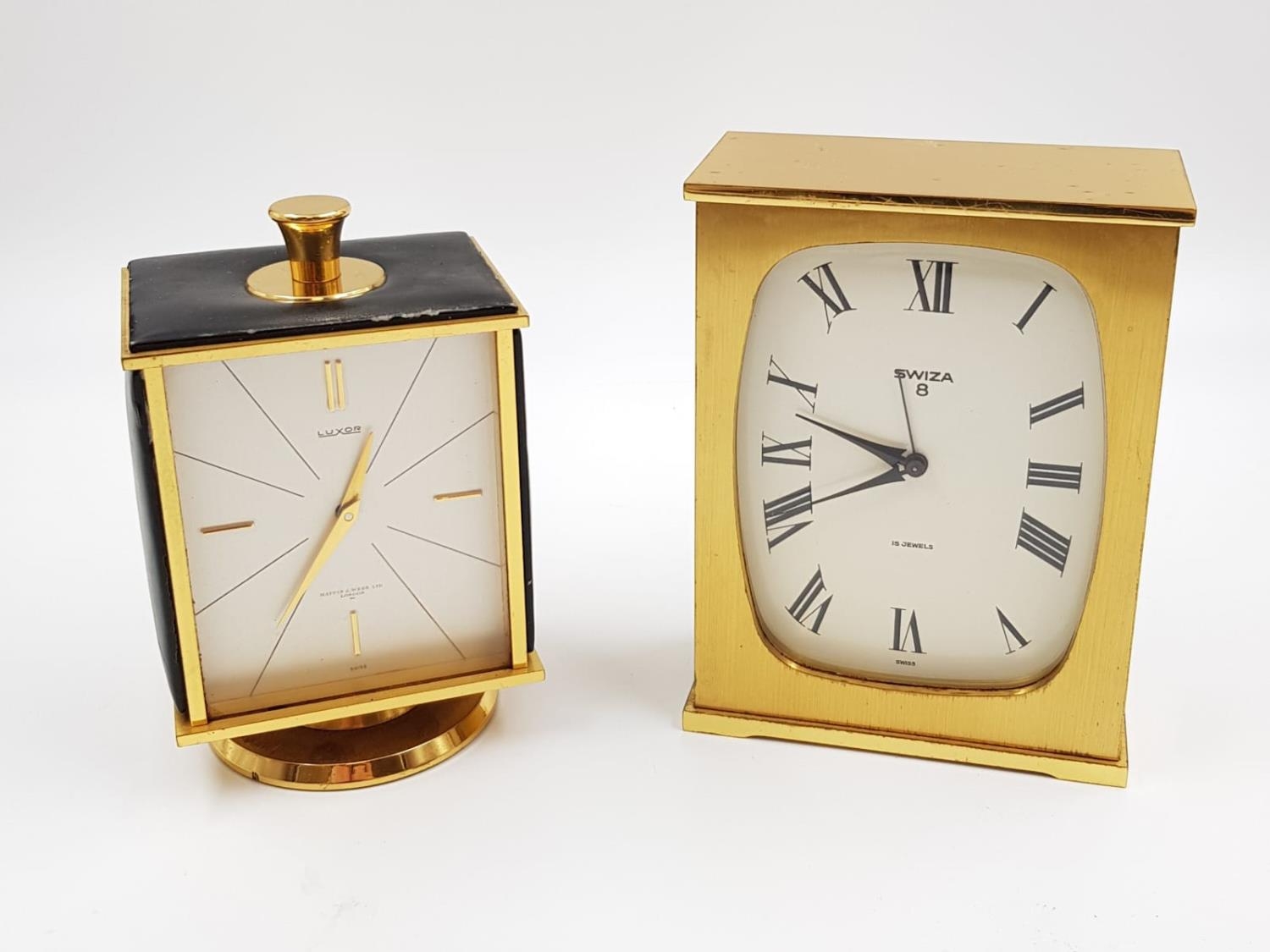 A pair of vintage carriage clocks. A swiza and a Luxor. As found. 14cm high.