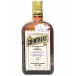 A bottle of 1970's Cointreau liquor.