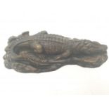 A vintage bronze sculpture of a resting crocodile. 33cm long.