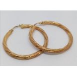 A pair of 9ct gold hoop earrings. 2.3g in weight.