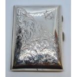 Antique silver cigarette case, having chased scroll and floral design. Clear hallmark for WJM &