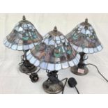 3 'Tiffany' style lamps in shades of Pacific blue. All in working order. 37cm high.