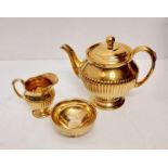 Stunning Royal Winton Grimwads golden tea set including a ribbed teapot, milk jug and sugar bowl,