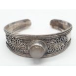 Vintage silver bangle with central moonstone. 21.9g in weight.