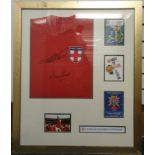 An iconic, 1966 styled framed England shirt signed by hat-trick hero Sir Geoff Hurst and Martin