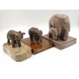 3 Vintage elephant figurines. 1 ceramic, made in France by Sevres, the other two are brass; one of
