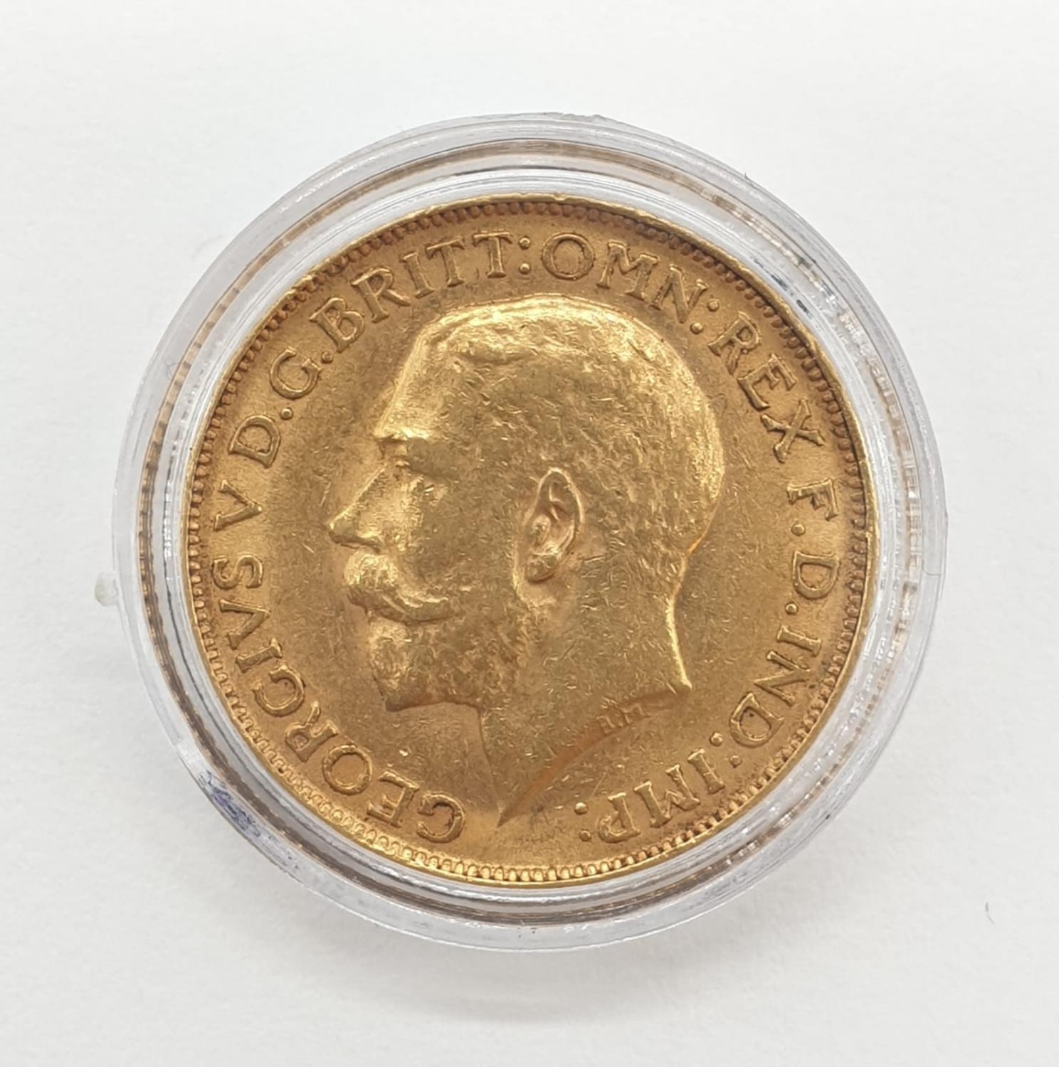 A King George V full gold sovereign dated 1911. London mint. 8 grams in weight. - Image 2 of 2