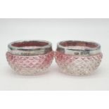 2x extraordinary rose tinted cut glass miniature pots topped with hallmarked silver collars,