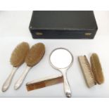 Silver travel vanity set of 6 pieces to include hand mirror, comb and brushes Birmingham hallmarks.