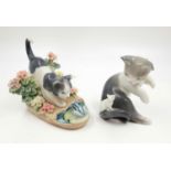 A pair of Lladro porcelain cat figurines. One with a frog, the other with a mouse. Good condition.