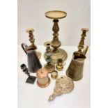 A selection of vintage bronze: candlesticks, jugs and a decorated tea container.
