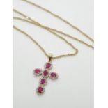 9CT DIAMOND AND RUBY CROSS PENDANT ON 44CM CHAIN , WEIGHT 3.8G