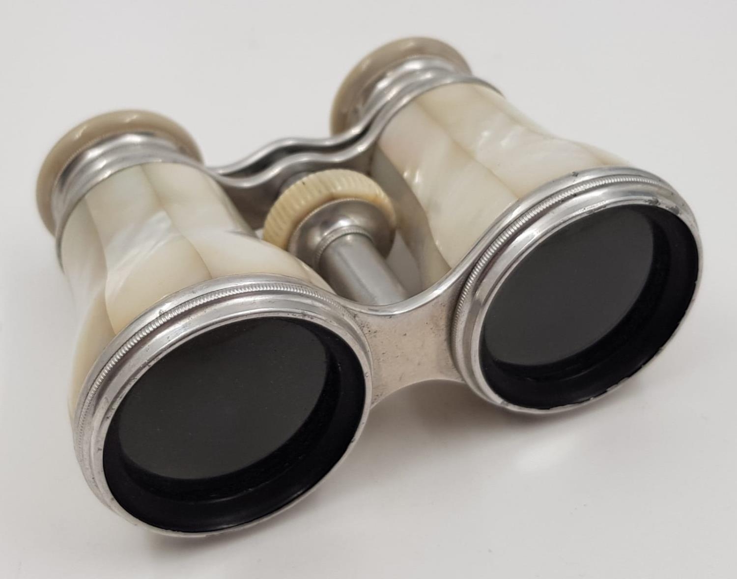 A glorious antique pair of mother of pearl opera glasses made by the famous Pillisher of New Bond