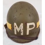 WW2 US M1 Military Police Front Seam Helmet & Liner. The Helmet was made by McCord with the batch