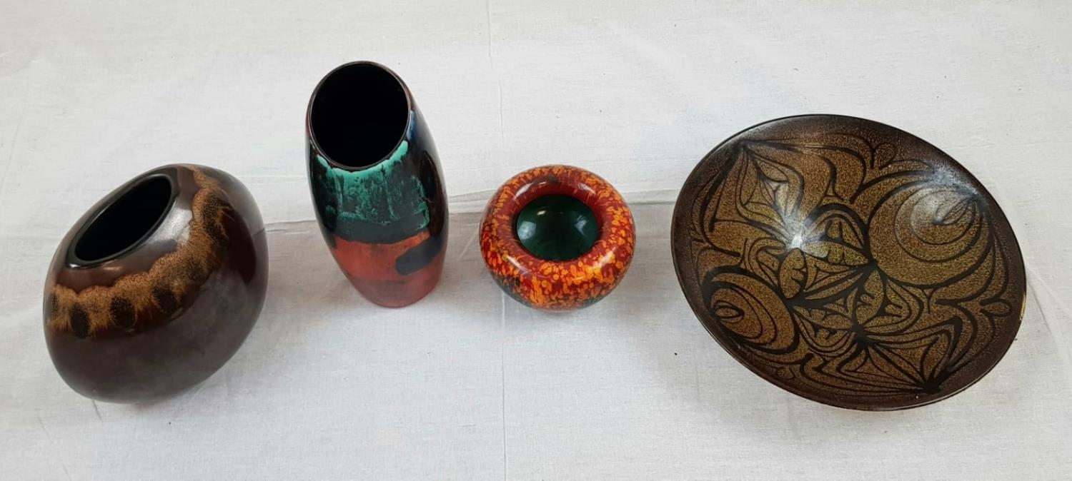 Four pieces of different shaped Poole pottery, including a funky vase from designer Andrew Tanner.