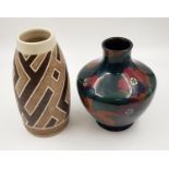Two different styled stoneware vases. One is a decore, with floral decoration, the other hand-made