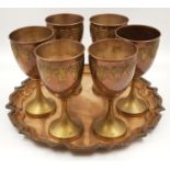 A vintage set of six copper goblets with serving tray.