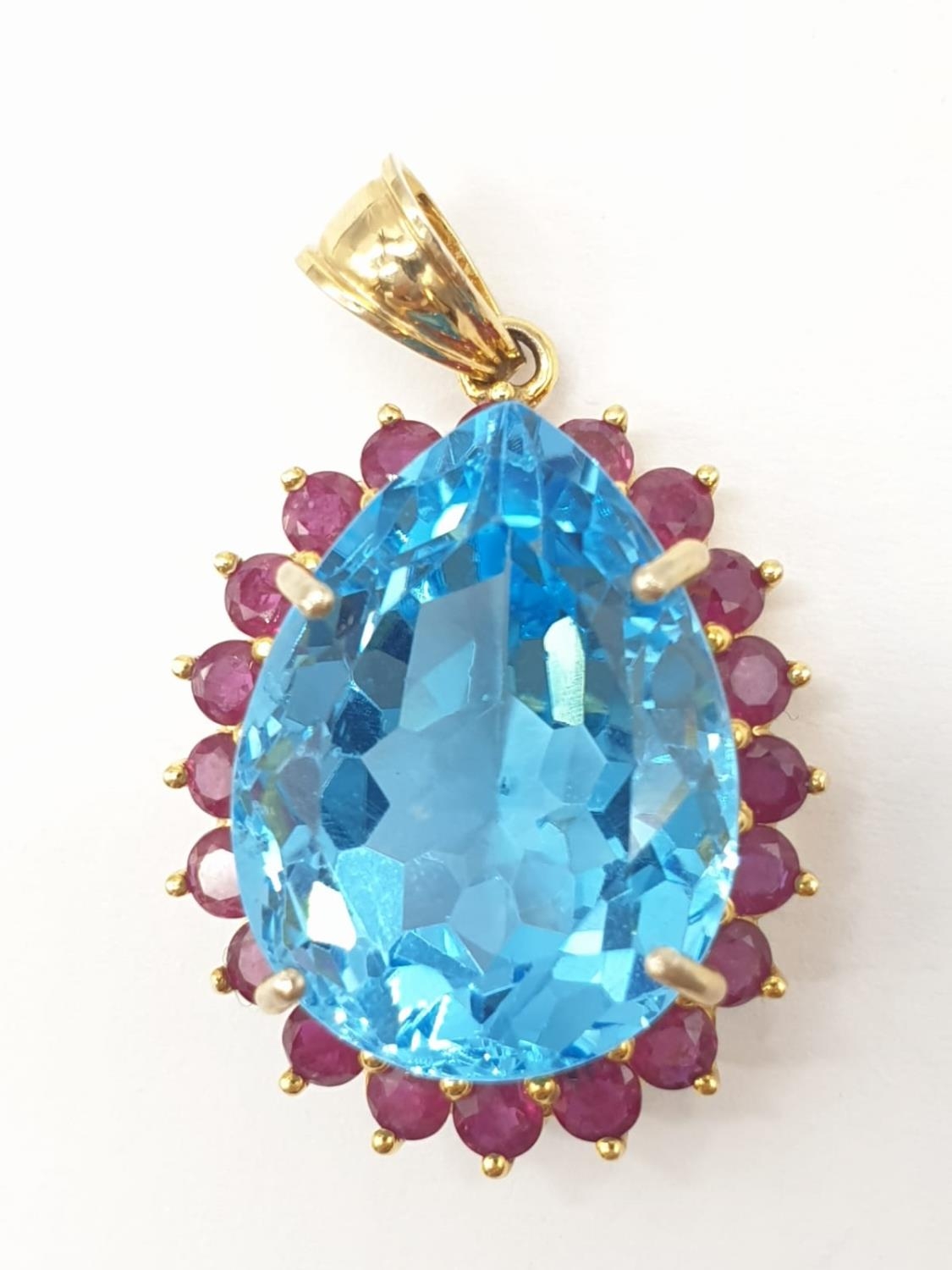 Topaz and ruby in 14ct gold pendant, weight 8g