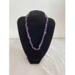 Amethyst necklace with pieces of amethyst mounted on elasticated twine. 45-50cm approx.