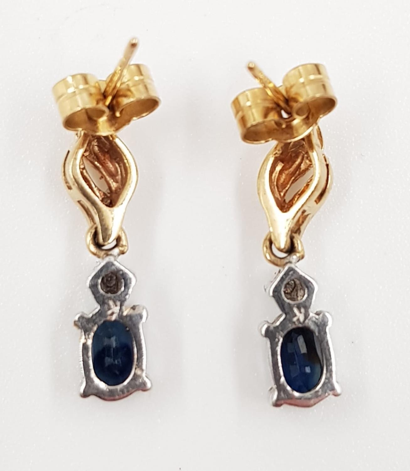 A pair of sapphire and diamond earrings in 9ct gold. 2.4g total weight. - Image 3 of 3