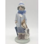 Lladro boy with dog. 20cm tall.