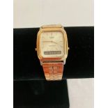 Vintage Casio AQ307 gents wristwatch. Gold tone with metal strap. Working order.