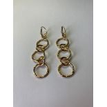 Silver multi hoop pair of earrings. 4.5cm drop. Gilded to appear as gold. 925 silver.