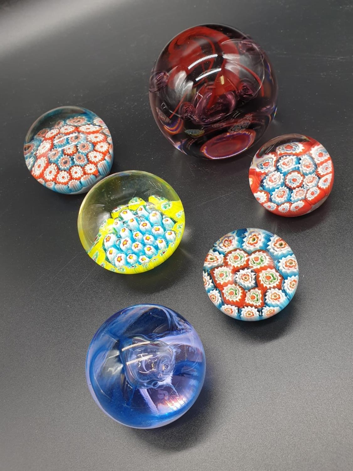 Collection of 6 paperweights, 4 are Millefiori styled, the other two are Caithness paperweights, the