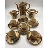 A beautiful decorated Japanese porcelain coffee set, includes coffee pot, cream and sugar jugs