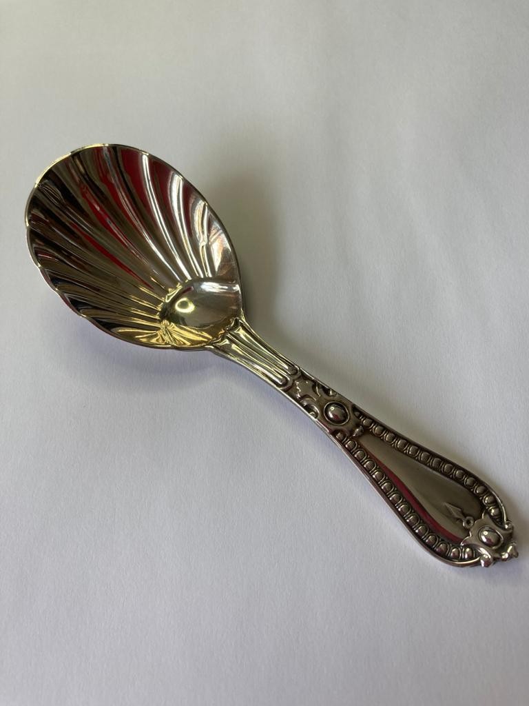 Early Victorian silver caddy spoon having a bowl in shell form and beadwork to handle. Hallmark