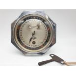 Hofmeier date calender clock with key, 15cm diameter.