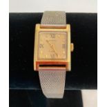 Vintage Sekonda wristwatch. Having square face and silver and gold tones. Mid-size, suitable for
