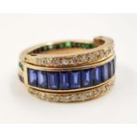 A stunning 18ct gold day and night ring incorporating bonds of ruby, sapphire and emerald. 7.6g