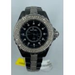 Chanel ceramic quart watch, black face with full diamond bezel and strap