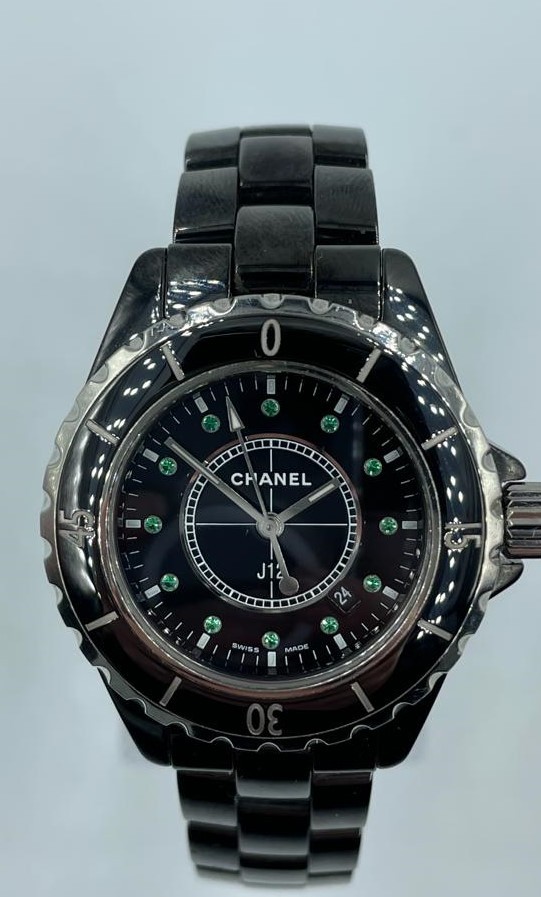 Chanel ceramic quartz watch model J12, black face and full diamonds set dial