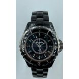 Chanel ceramic quartz watch model J12, black face and full diamonds set dial