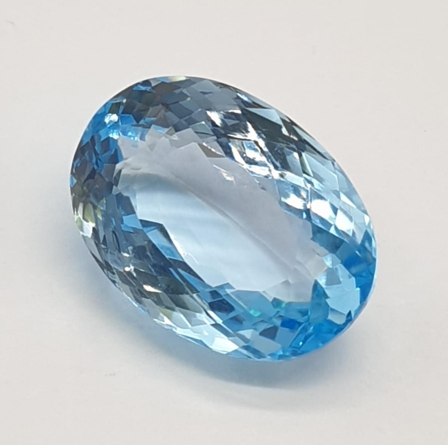 A 17.33 Cts Blue topaz. Oval mixed cut. IDT certification included.