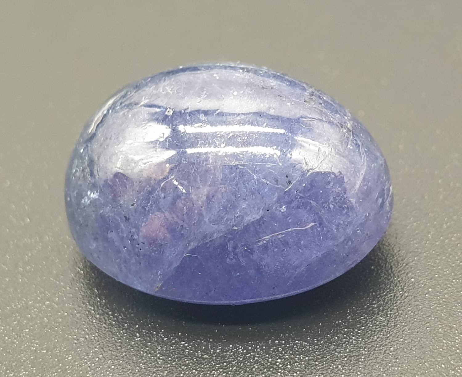 23.69ct oval cabochon Tanzanite gemstone, IGL&I certified