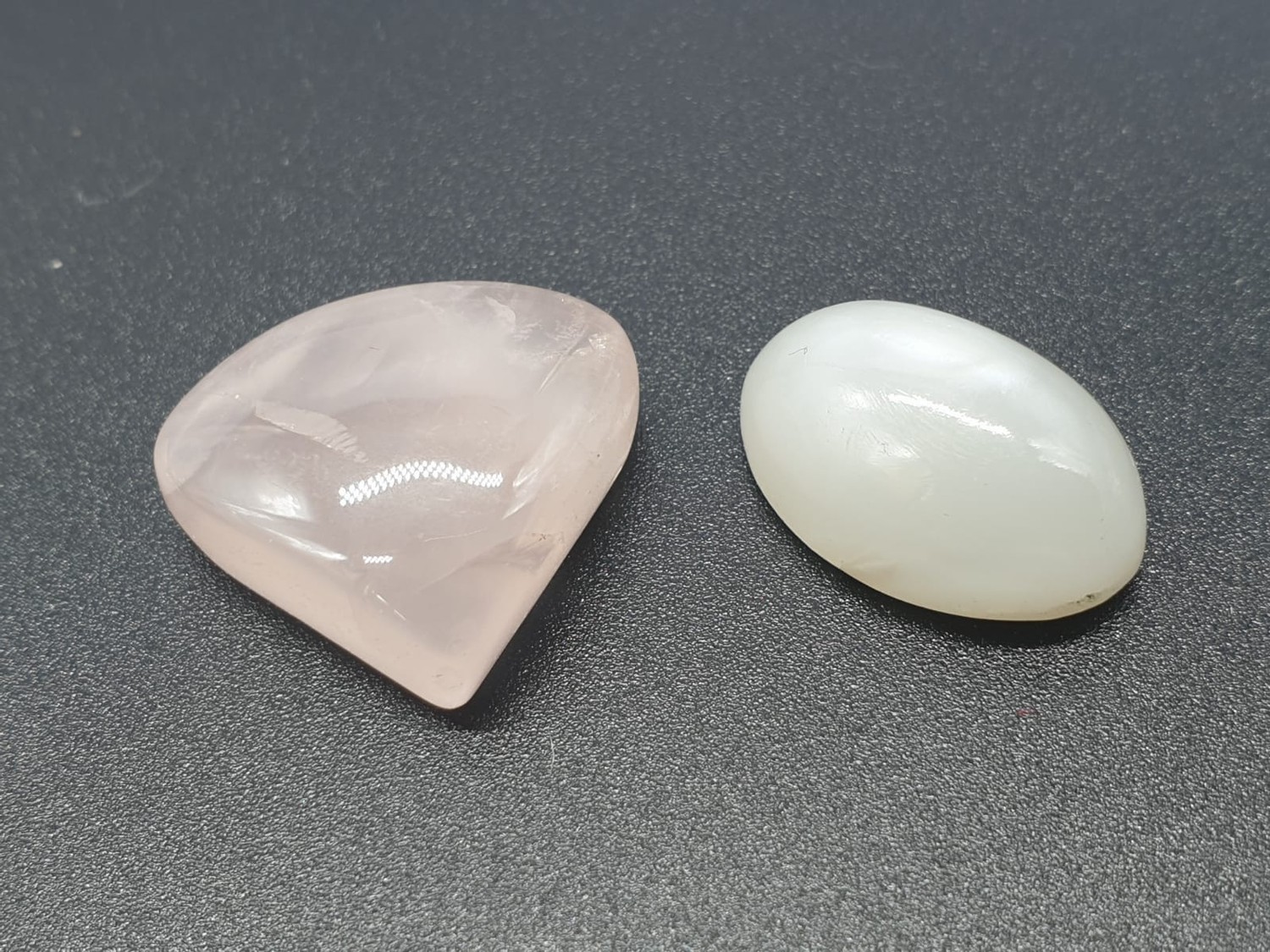 10.97ct grey moonstone PLUS 20.08ct rose quartz, both IGL&I certified