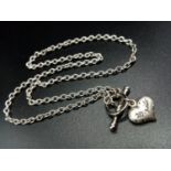 9ct white gold chain and heart pendant. Weighs 5g and aprox 45cm long.