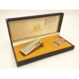 Gold tone (Win International) Vintage lighter, in original box.