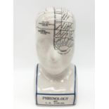A PHRENOLOGY ceramic bust with detailed mapping of the various areas of the cranial area. By L. N.