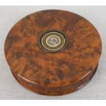 An Antique Walnut Ladies Compact, with gilded centre. 8cm diameter.