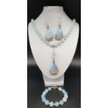 A moonstone necklace, bracelet and earrings set in a presentation box. Necklace length: 50cm,