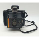 A vintage Polaroid super colour swing land camera. As found.